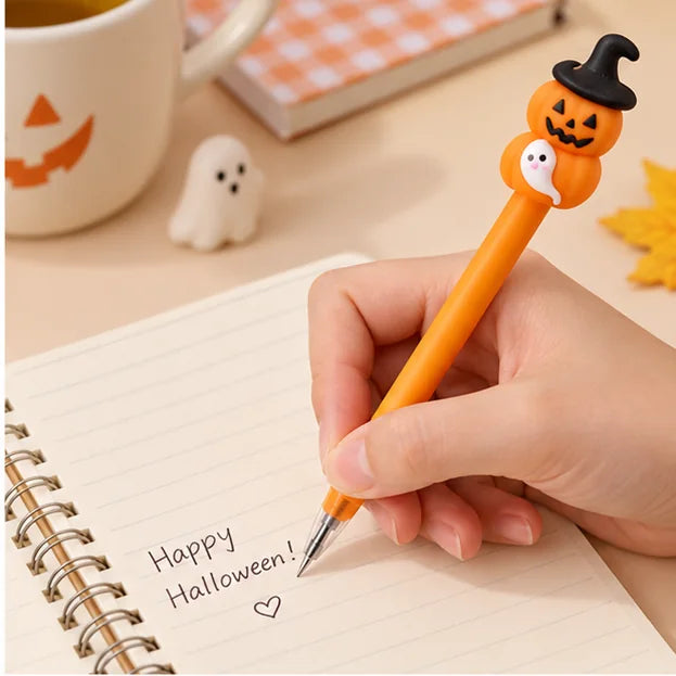 Hand schreibt mit einem Halloween Gelstift