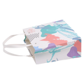 Kleine Geschenktragetasche aus Papier mit abstraktem Print (Mehrfarbig)
